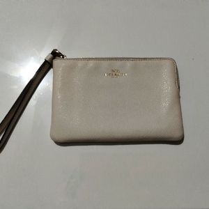 Coach minimalist beige wristlet with gold lettering perfect like new